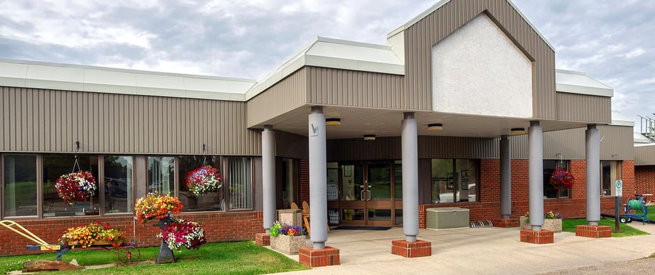 Exterior view of Northcott Care Centre entrance with flower arrangements