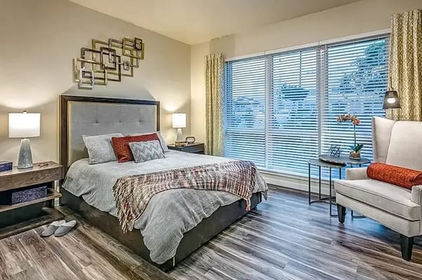 Well-furnished resident bedroom in a senior living facility