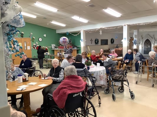 Residents enjoying activities in a community room