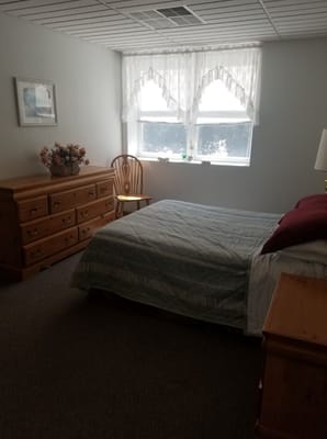 Cozy private resident room with window and furniture