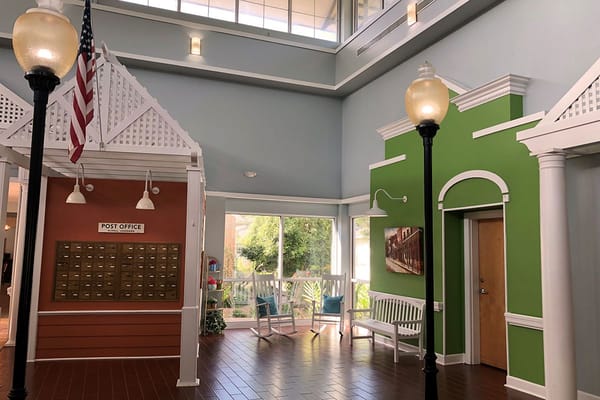 Bright lobby area with a post office and seating