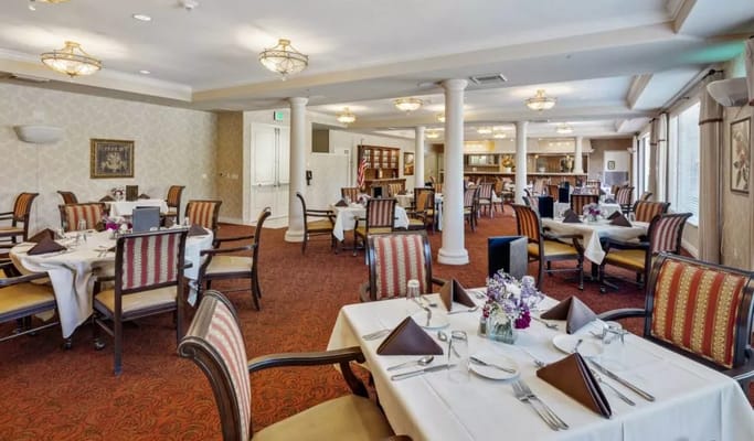 Dining area with elegant table settings and decor