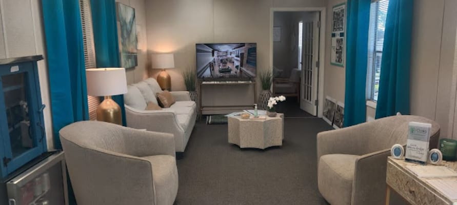 Cozy common area with seating and a TV