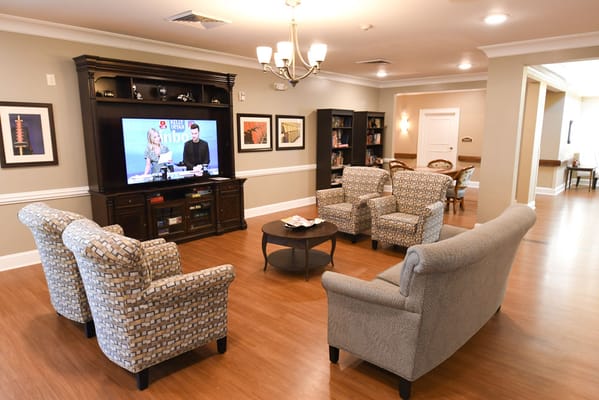 Common area with seating and television