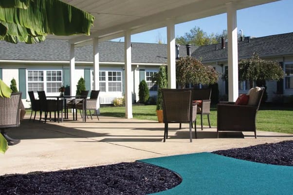 Outdoor seating area with tables and chairs