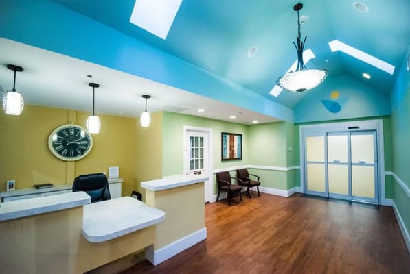 Reception area of a senior care facility with a clock