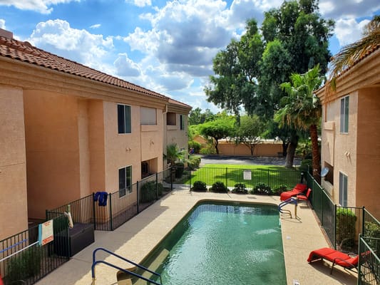 Overview of the pool area surrounded by buildings