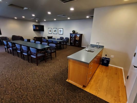 Interior view of a common area with tables and seating