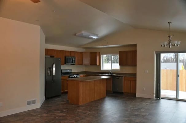 Spacious kitchen area with modern appliances