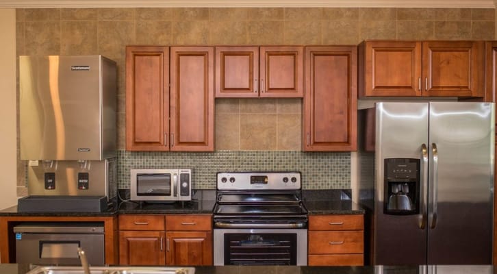 Stylish kitchen with stainless steel appliances and wooden cabinets