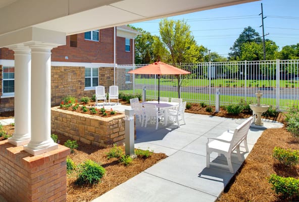 Outdoor courtyard with seating and landscaping