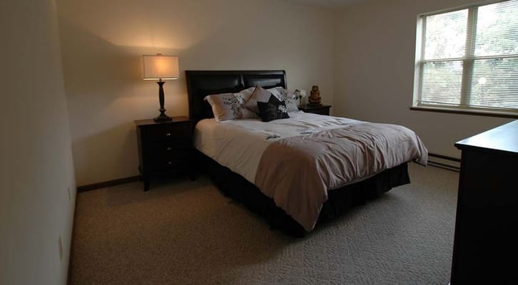 Cozy private bedroom in a senior living facility