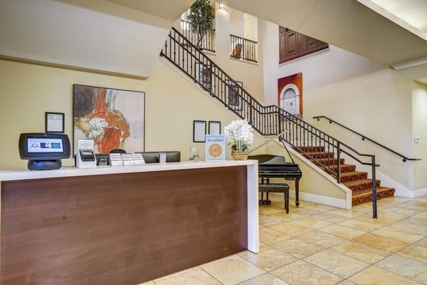 Reception desk with staircase in the background