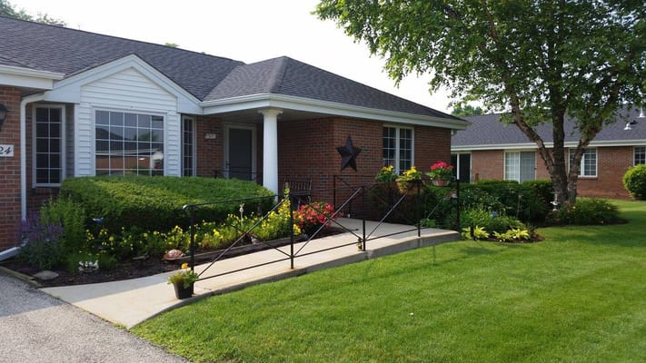 Exterior view of Peterson Meadows with outdoor flowers