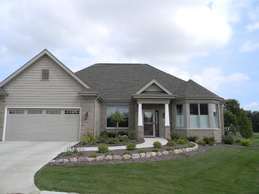 Exterior view of a residential facility with landscaped front yard