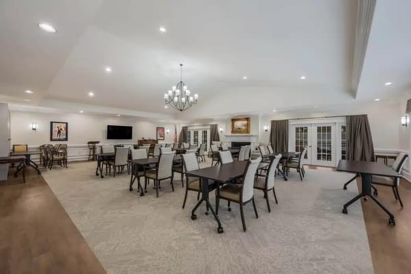 Spacious lounge area with tables and chairs