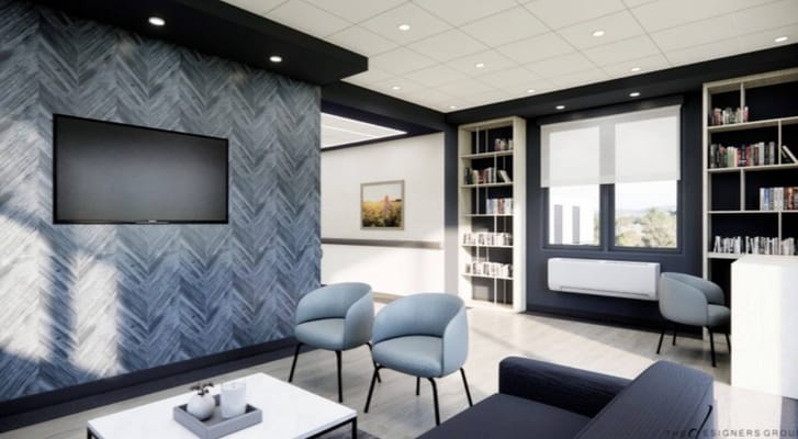 Modern common area with seating and bookshelves