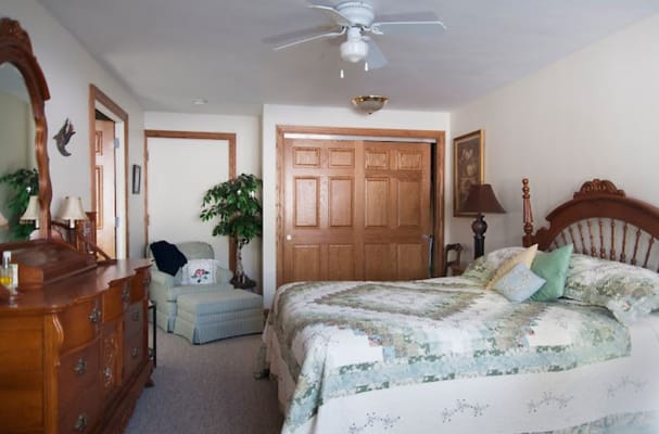 Cozy resident room with a bed and sitting area