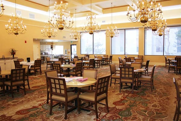 Elegant dining room with chandeliers and dining tables