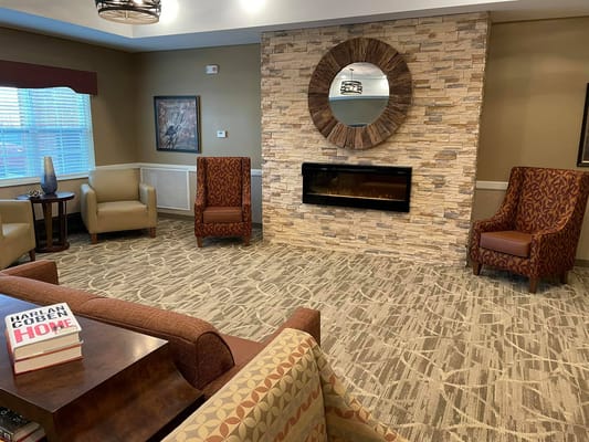 Cozy common area with seating and a fireplace