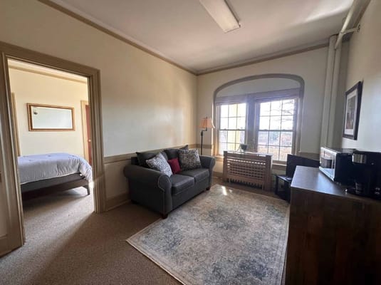 Cozy resident room with a view and comfortable seating