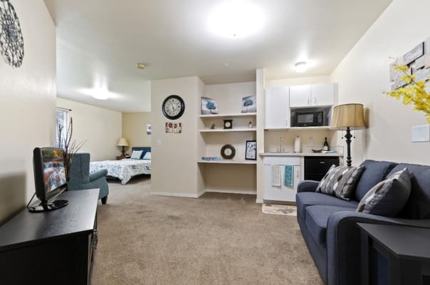 Cozy interior of a resident's room with a sitting area