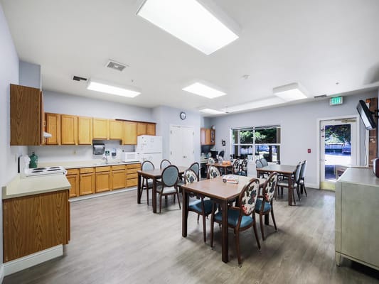 Bright dining area with tables and chairs