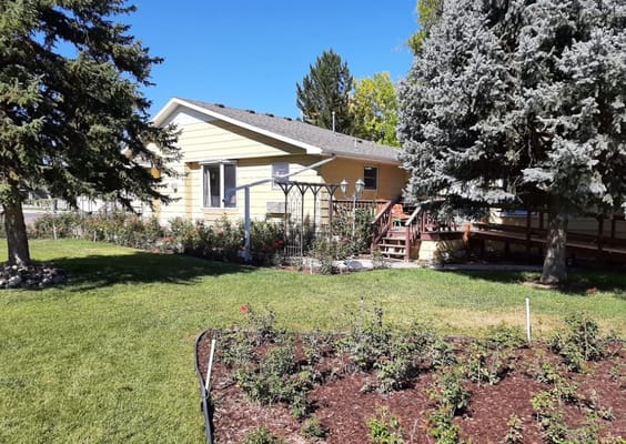 Exterior view of a personal care home with garden