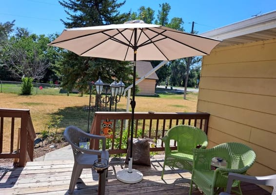 Outdoor seating area with a large umbrella