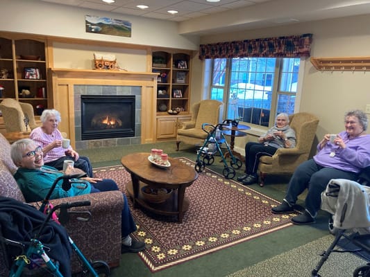 Residents enjoying tea in a cozy common area
