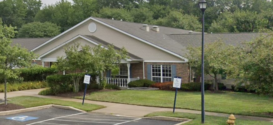 Exterior view of a skilled nursing facility with landscaping