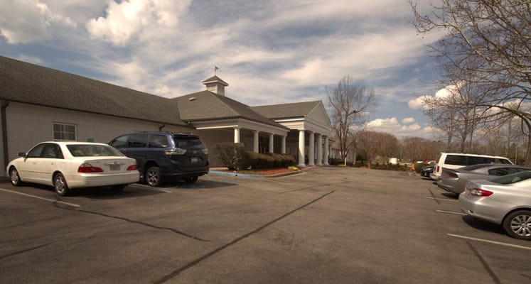 Exterior view of facility entrance and parking area