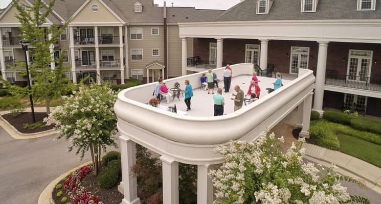 Residents enjoying an outdoor space on a sunny day