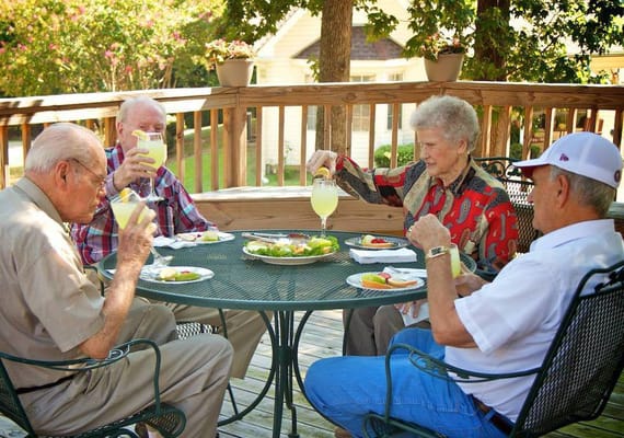 Residents enjoying refreshments on a patio