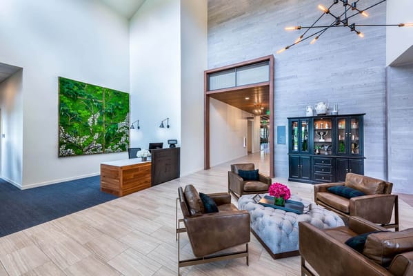 Bright and modern lobby area with seating and artwork