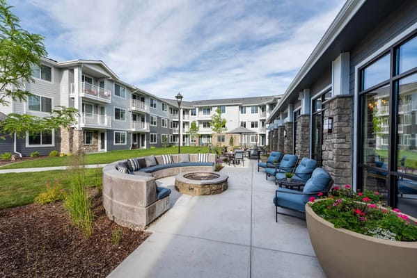 Outdoor seating area with fire pit and gardens