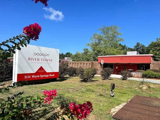 Exterior view of River Towne Center facility with sign