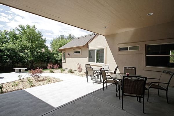 Outdoor patio area with seating and garden views