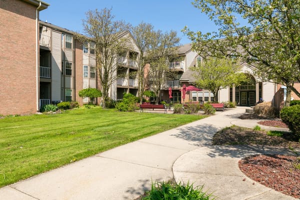 Beautiful garden area with pathways and buildings