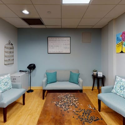 Cozy common area with seating and artwork