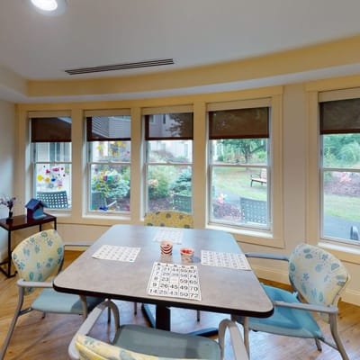 Activity room with a bingo setup and seating