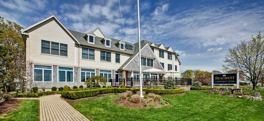 Exterior view of Seacrest Retirement Center with landscaped grounds