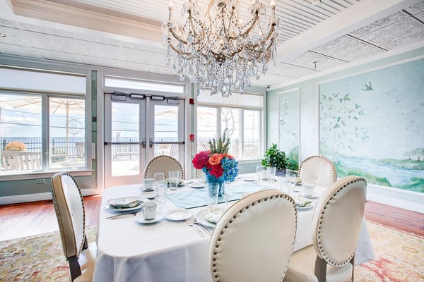 Elegant dining room set for a meal with floral centerpiece