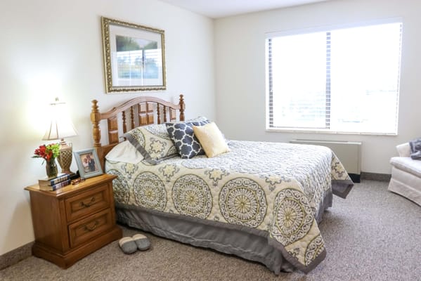Cozy resident room with a bed and natural light