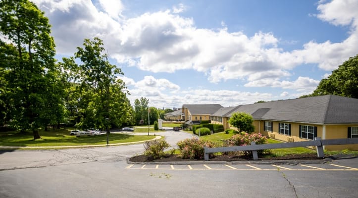 Outdoor view of Capitol Ridge at Providence with lush greenery and a clear blue sky