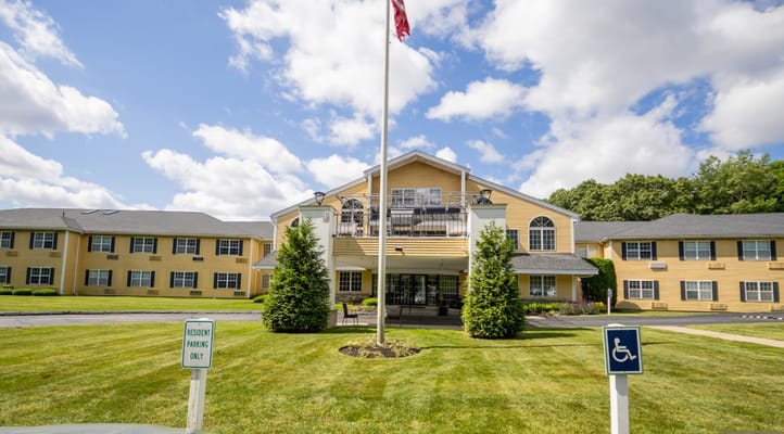 Main entrance of Capitol Ridge at Providence with American flag