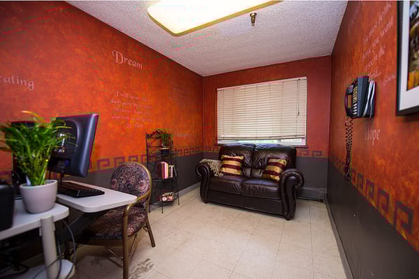 Cozy seating area with motivational quotes on the wall