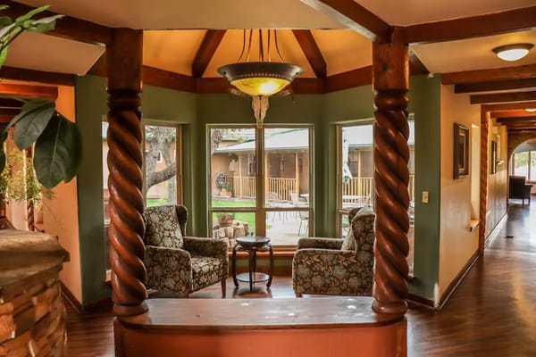 Interior common area with cozy seating and large windows