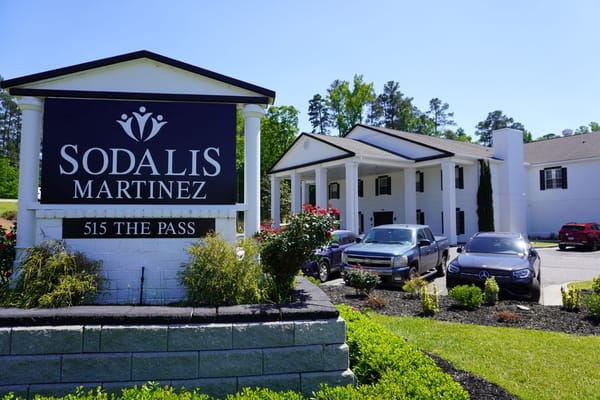 Sodalis Martinez sign in front of the building