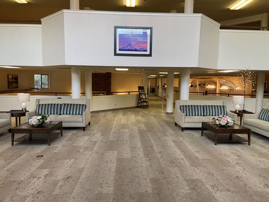 Bright common area with seating and decor.
